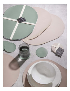 Hugo sage placemats styled with tableware