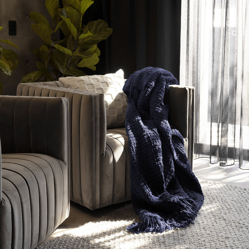 Bambury Asha Chenille Throw Navy - lifestyle on sofa