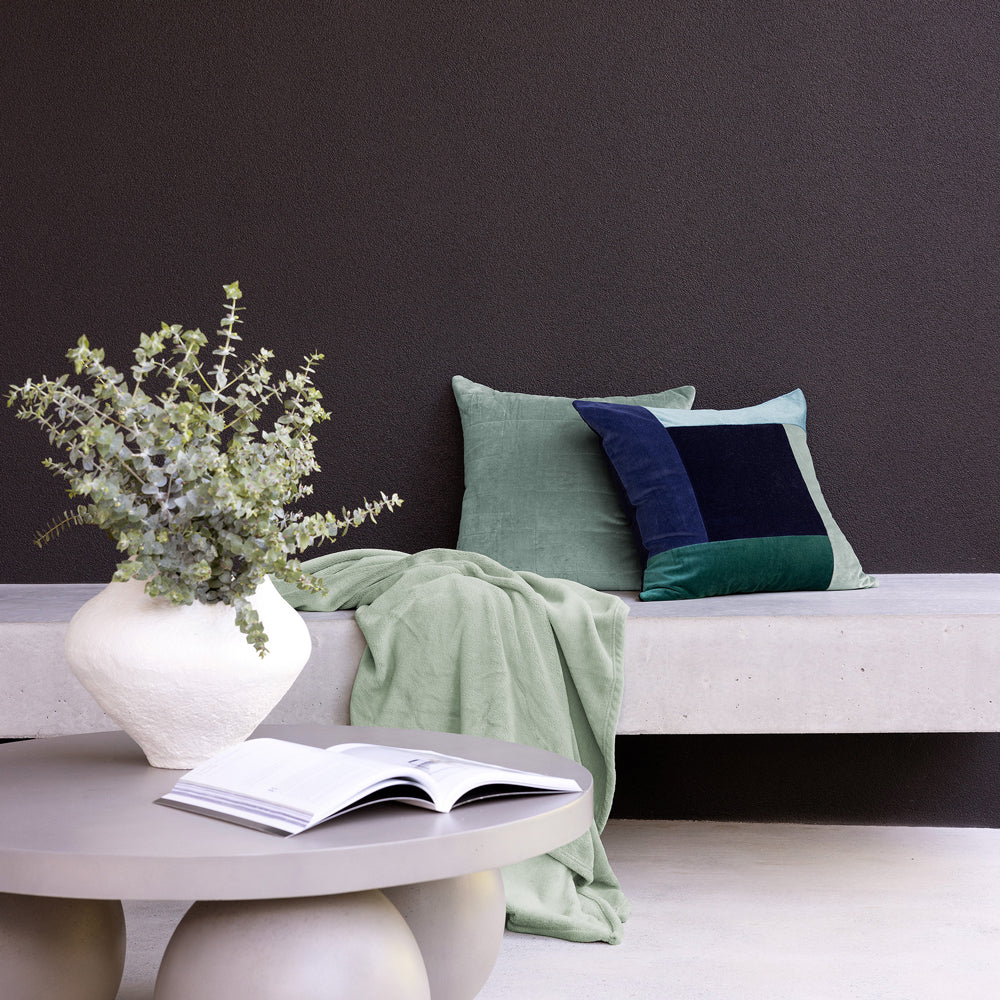 Bambury Jax Square Cushion Ocean - cushion styled on bed or sofa
