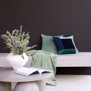 Bambury Jax Square Cushion Ocean - cushion styled on bed or sofa