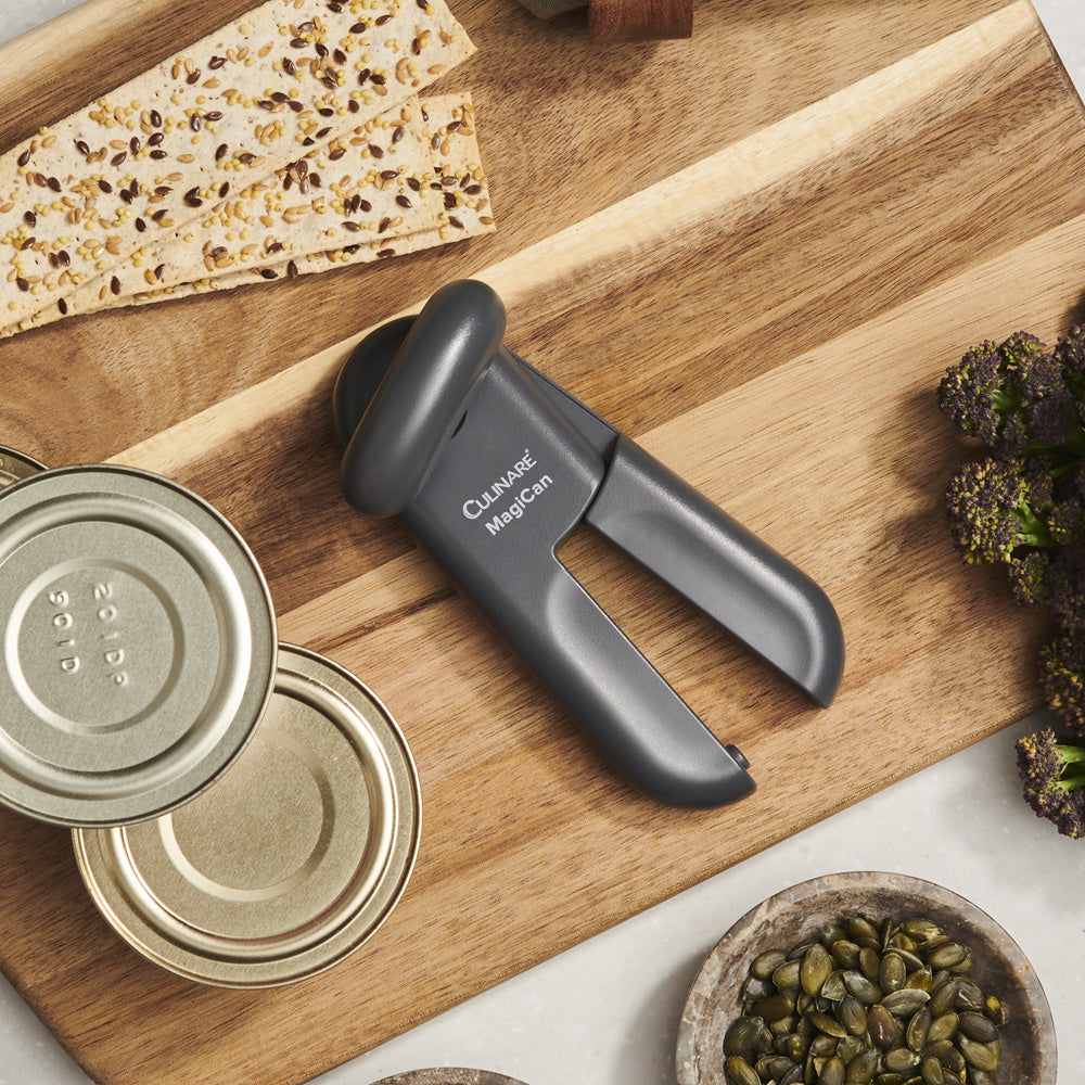 SKU 7501N Culinare MagiCan Can Opener Smooth Edge Grey on kitchen board with opened cans