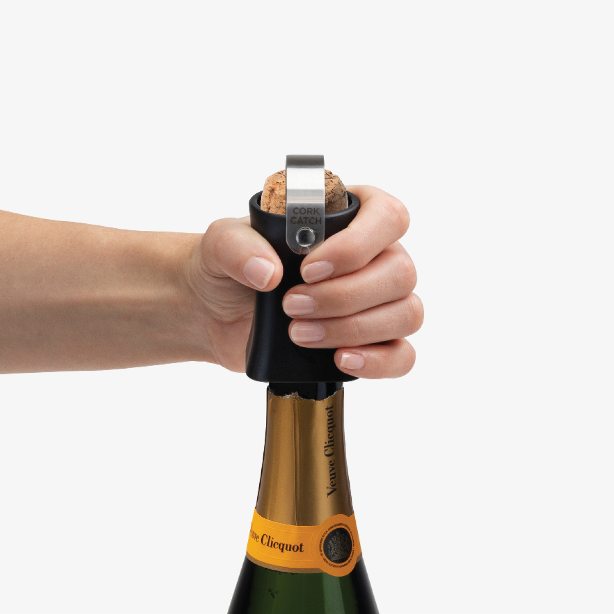 Champop fitted over a champagne cork ready to pop
