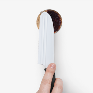 Dreamfarm Knibble Lite Black - non-stick cheese knife in use