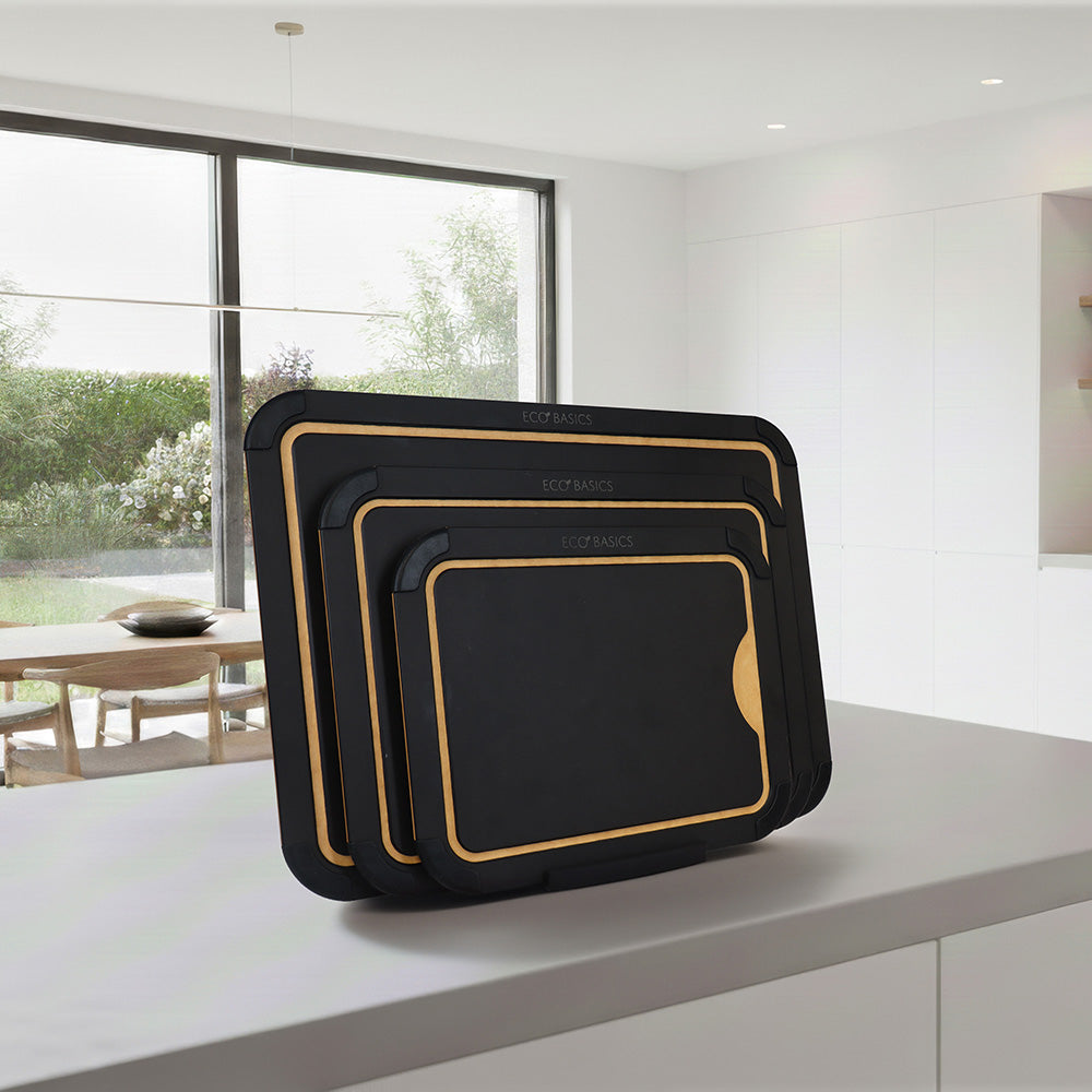 White Magic Eco Basics Chopping Board Set 4 Piece with Holder Black - in use on kitchen bench