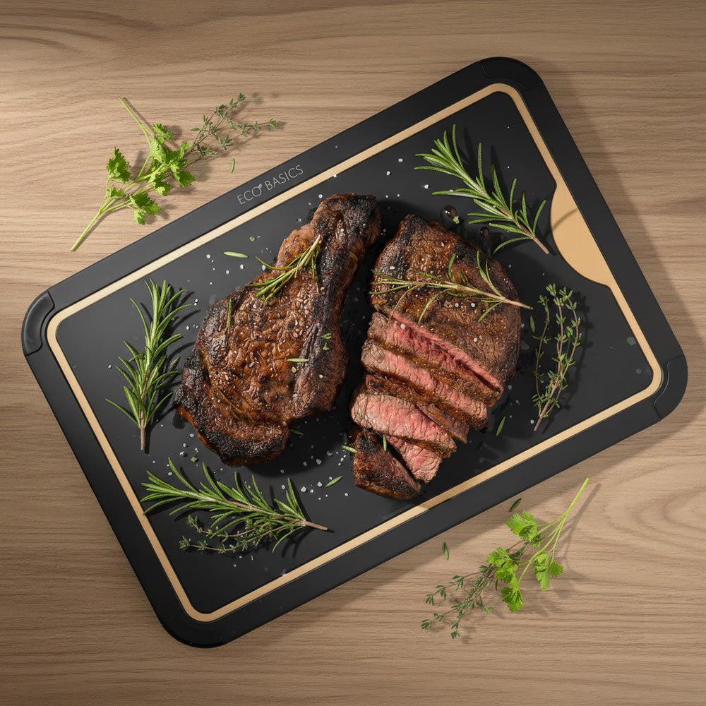 White Magic Eco Basics Carving Board with Juice Groove Black Large - in use on kitchen bench