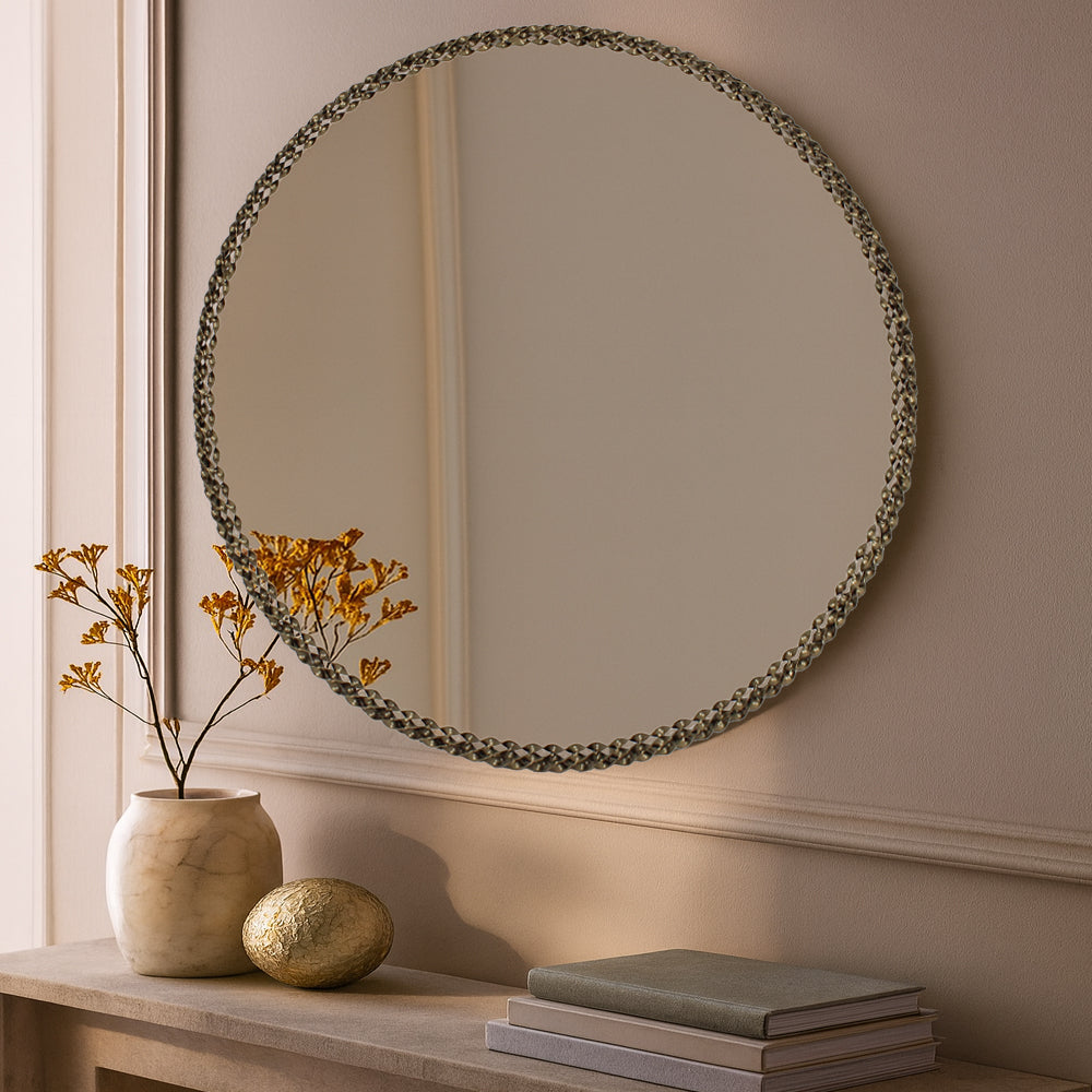 Celeste braided gold round mirror styled on a wall