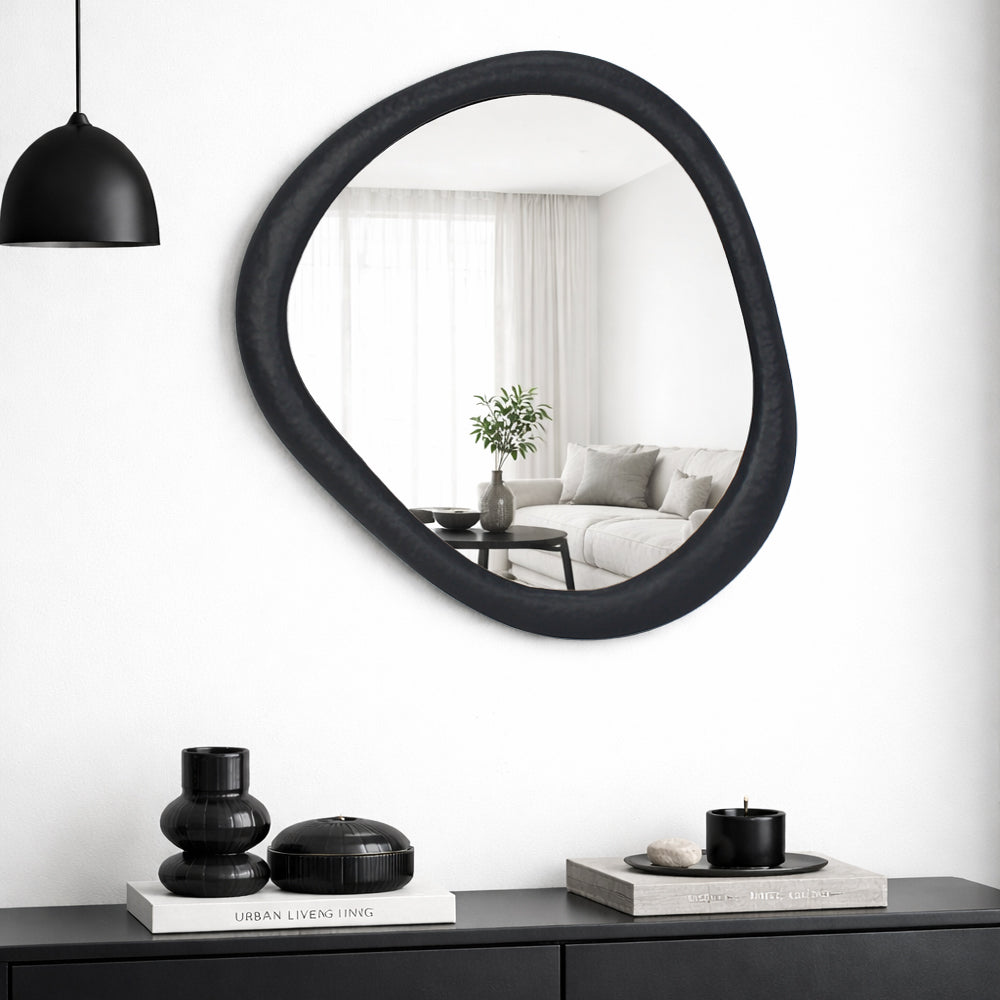 Gemma matt black metal mirror styled on a wall