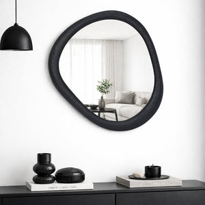 Gemma matt black metal mirror styled on a wall