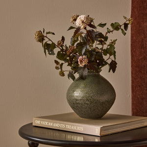 Hans dark green vase styled with dried stems
