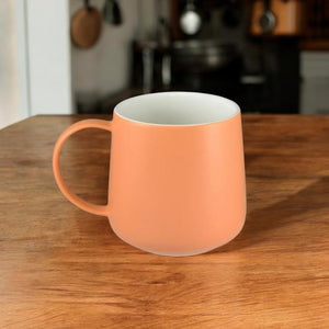 Cafe Life apricot mug with white glazed interior