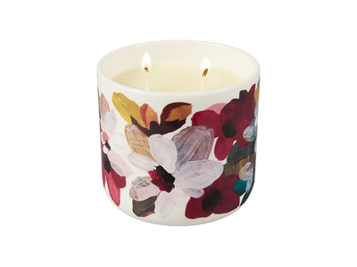 Love Anna Magnolia candle 310g lit - warm burgundy porcelain vessel