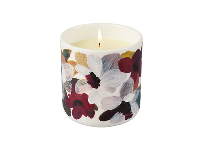 Love Anna Magnolia candle lit - warm burgundy porcelain vessel