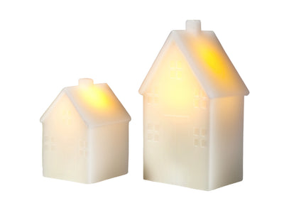 Let's Get Lit Christmas LED house candle set of 2 in cream, lit, angled view – Maxwell & Williams
