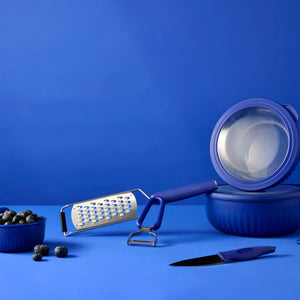 SVNA julienne peeler in use — slicing vegetables into uniform strips