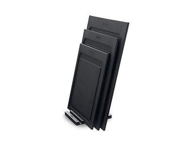 Woll Cut & Serve Board Black 30x22x0.7cm - angled view showing juice groove